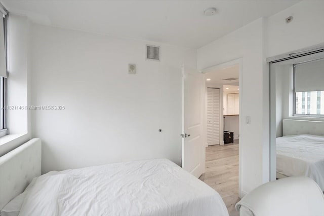 111 E Flagler St Unit 1309, Miami, FL 33131 - bedroom with light wood-style floors