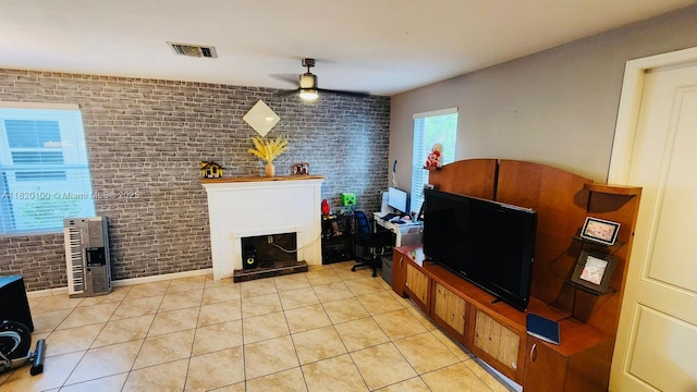 2190 SE 2nd St, Homestead, FL 33033 - living area with brick wall, a ceiling fan, light tile patterned floors, heating unit, and a fireplace with raised hearth