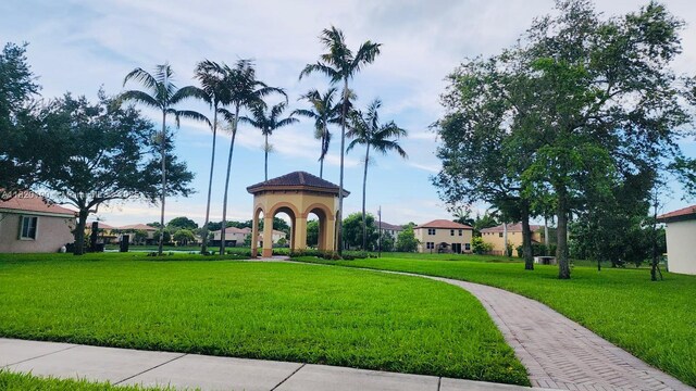 2190 SE 2nd St, Homestead, FL 33033 - view of home's community with a yard
