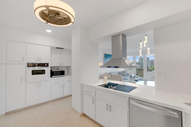 3200 NE 36th St Unit 1221, Fort Lauderdale, FL 33308 - kitchen with stainless steel appliances, island exhaust hood, light countertops, white cabinetry, and recessed lighting
