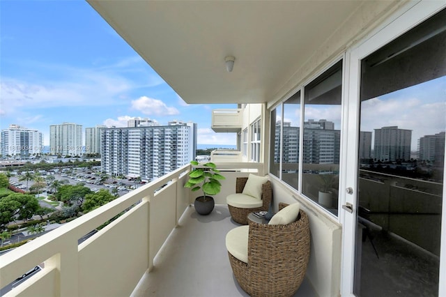 3200 NE 36th St Unit 1221, Fort Lauderdale, FL 33308 - balcony featuring a city view and a wall unit AC