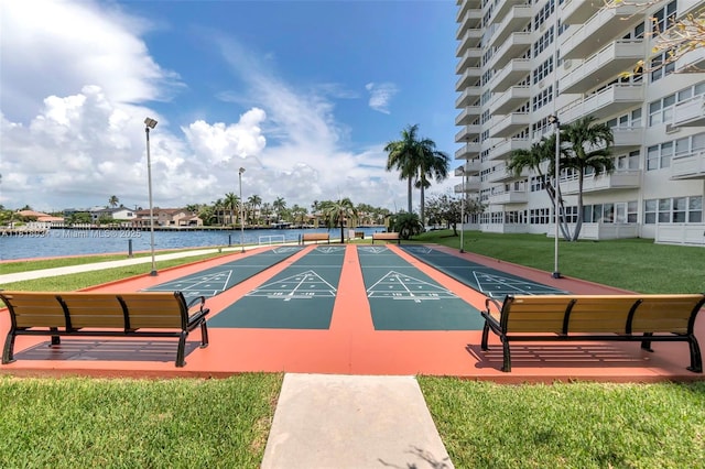 3200 NE 36th St Unit 1221, Fort Lauderdale, FL 33308 - view of community featuring shuffleboard, a yard, and a water view