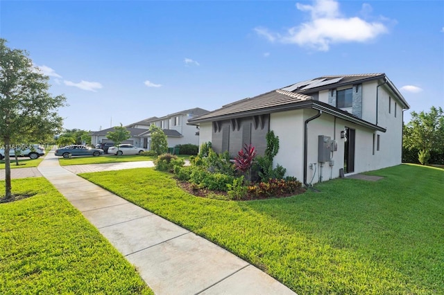 13005 Addilyn Ct, Davie, FL 33325 - view of side of home with a lawn and stucco siding
