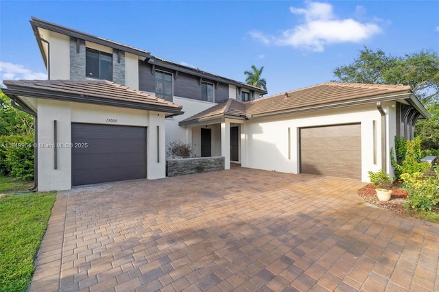 13005 Addilyn Ct, Davie, FL 33325 - view of front of property featuring stucco siding, decorative driveway, and a tiled roof