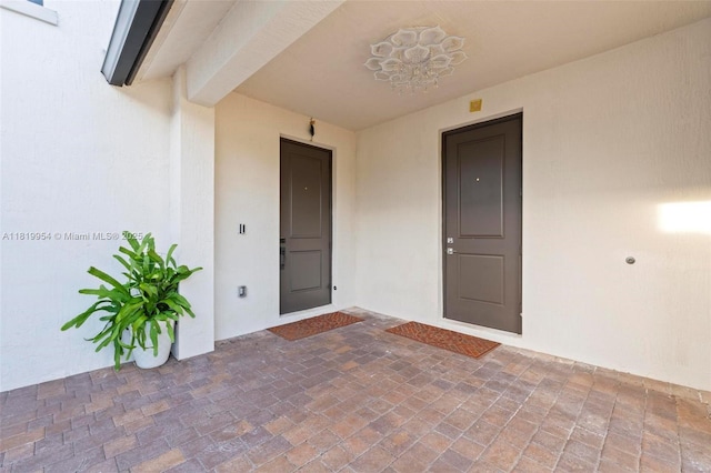 13005 Addilyn Ct, Davie, FL 33325 - view of exterior entry with stucco siding