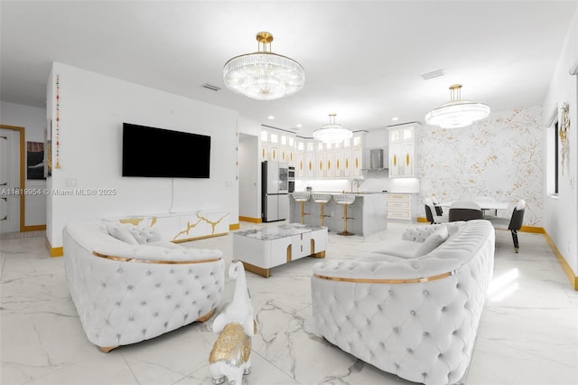 13005 Addilyn Ct, Davie, FL 33325 - living area featuring a chandelier and light marble finish flooring