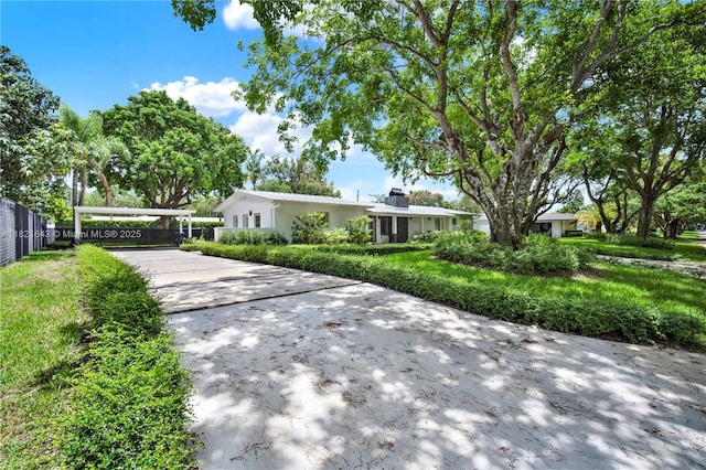 14625 SW 83rd Pl, Palmetto Bay, FL 33158 - view of front facade featuring concrete driveway and a carport