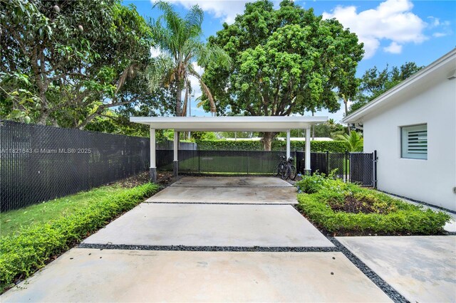 14625 SW 83rd Pl, Palmetto Bay, FL 33158 - view of parking featuring a carport and driveway