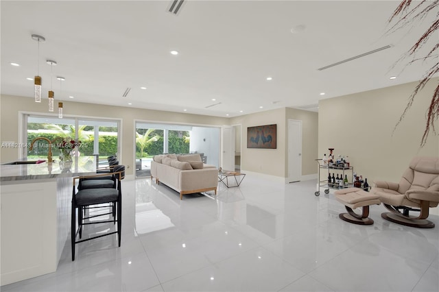 14625 SW 83rd Pl, Palmetto Bay, FL 33158 - living room featuring healthy amount of natural light, light tile patterned floors, and recessed lighting