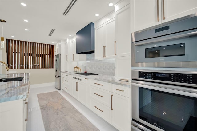 14625 SW 83rd Pl, Palmetto Bay, FL 33158 - kitchen featuring wall chimney range hood, stainless steel appliances, white cabinets, decorative backsplash, and light stone countertops