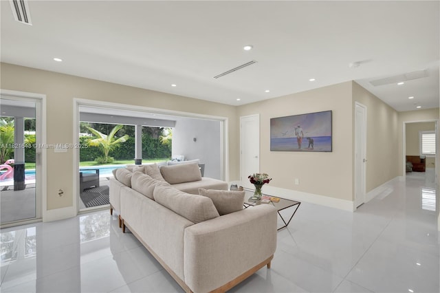 14625 SW 83rd Pl, Palmetto Bay, FL 33158 - living room with light tile patterned floors and recessed lighting