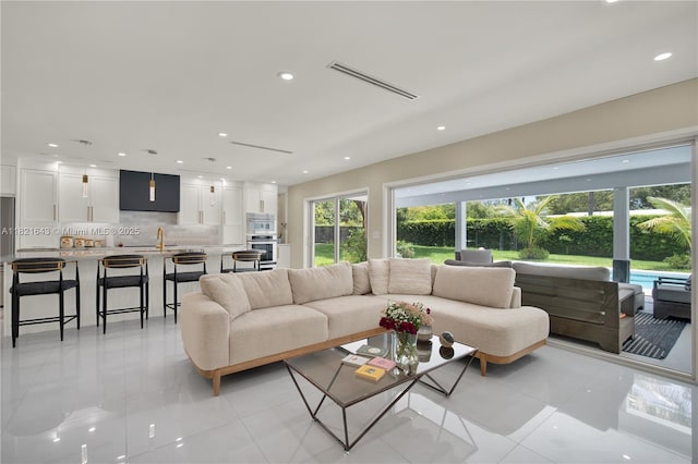 14625 SW 83rd Pl, Palmetto Bay, FL 33158 - living room featuring plenty of natural light, recessed lighting, and light tile patterned flooring