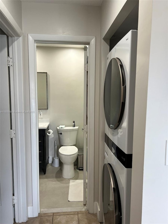 13766 SW 147th Cir Ln Unit 1-20, Miami, FL 33186 - bathroom with stacked washer / drying machine, vanity, and tile patterned flooring