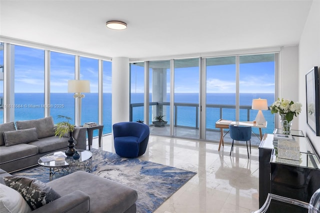 6899 Collins Ave Unit 2707, Miami Beach, FL 33141 - living room with expansive windows, a water view, marble tiled flooring, and plenty of natural light