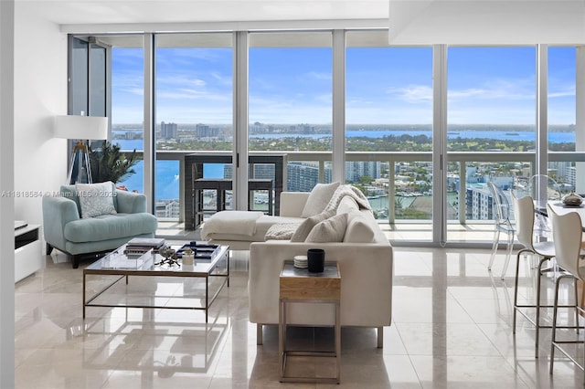 6899 Collins Ave Unit 2707, Miami Beach, FL 33141 - living area featuring expansive windows, plenty of natural light, a water view, and a view of city