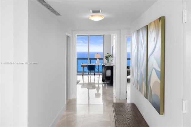 6899 Collins Ave Unit 2707, Miami Beach, FL 33141 - hall with a water view and baseboards