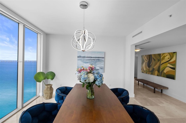 6899 Collins Ave Unit 2707, Miami Beach, FL 33141 - dining space with a chandelier and tile patterned flooring
