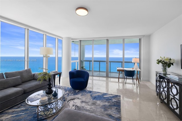 6899 Collins Ave Unit 2707, Miami Beach, FL 33141 - living room with floor to ceiling windows, a water view, and plenty of natural light