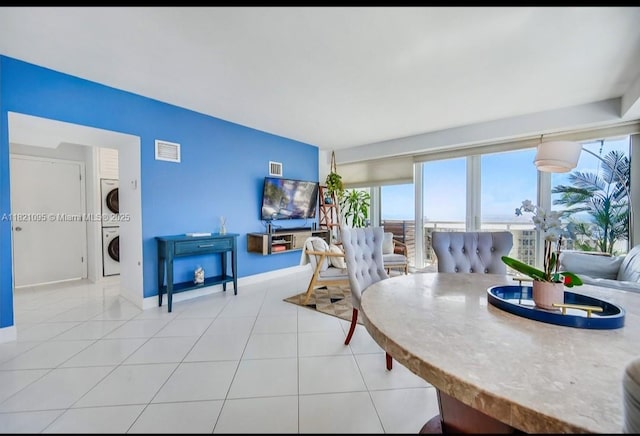 1920 S Ocean Dr Unit 901, Fort Lauderdale, FL 33316 - dining room with estacked washer and dryer and light tile patterned floors