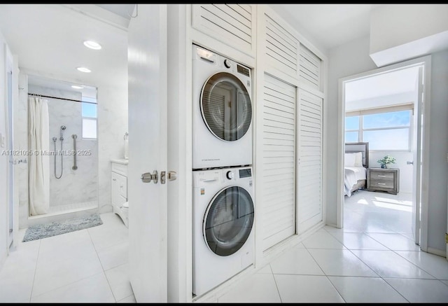 1920 S Ocean Dr Unit 901, Fort Lauderdale, FL 33316 - laundry room featuring stacked washer / drying machine, light tile patterned flooring, healthy amount of natural light, and recessed lighting
