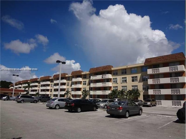 1800 Sans Souci Blvd Unit 201, North Miami, FL 33181 - view of apartment building / complex with uncovered parking