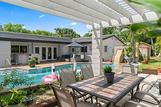930 NE 182nd Ter, North Miami Beach, FL 33162 - swimming pool with french doors, an outdoor living space, a pergola, outdoor dining area, and a grill