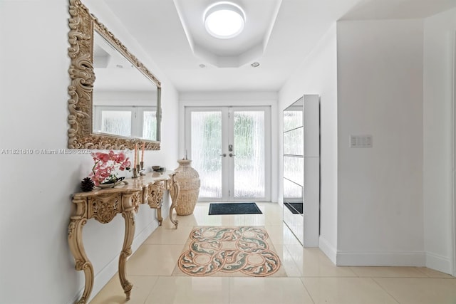 930 NE 182nd Ter, North Miami Beach, FL 33162 - entryway featuring french doors, a tray ceiling, and tile patterned floors