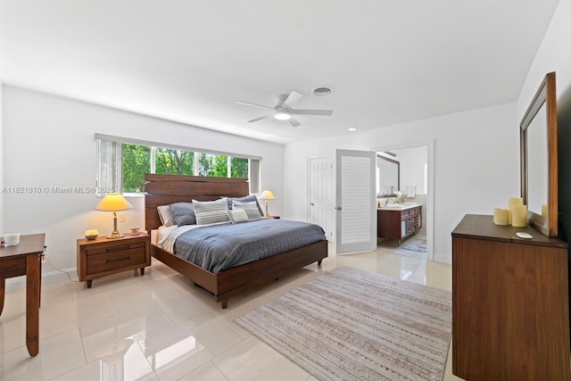 930 NE 182nd Ter, North Miami Beach, FL 33162 - bedroom featuring light tile patterned flooring, a ceiling fan, and ensuite bath