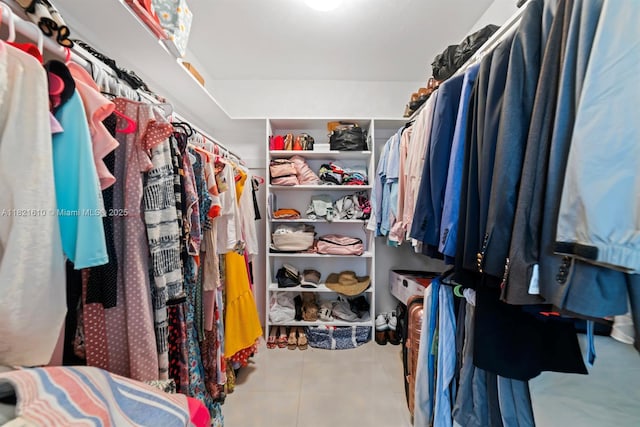 930 NE 182nd Ter, North Miami Beach, FL 33162 - walk in closet featuring tile patterned flooring