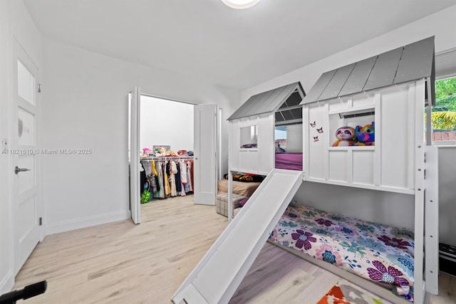 930 NE 182nd Ter, North Miami Beach, FL 33162 - bedroom featuring light wood-style flooring