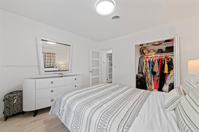 930 NE 182nd Ter, North Miami Beach, FL 33162 - bedroom featuring light wood finished floors and a closet