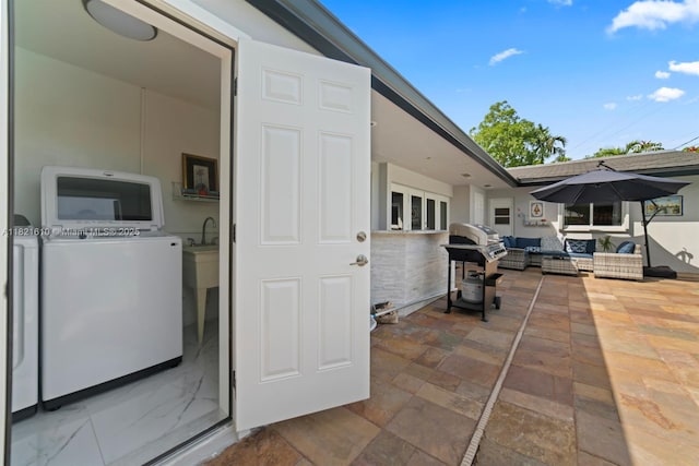 930 NE 182nd Ter, North Miami Beach, FL 33162 - view of patio with outdoor lounge area, area for grilling, and independent washer and dryer