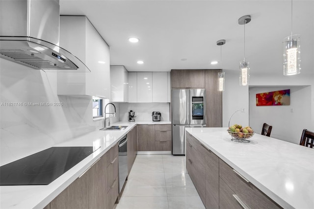 7100 Mcclellan St, Hollywood, FL 33024 - kitchen featuring modern cabinets, wall chimney range hood, stainless steel appliances, light countertops, and recessed lighting