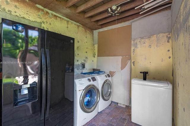 7100 Mcclellan St, Hollywood, FL 33024 - laundry area featuring washer and dryer and brick patterned floors