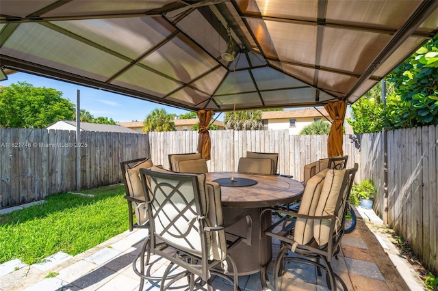 7100 Mcclellan St, Hollywood, FL 33024 - fenced backyard with outdoor dining space, a gazebo, and a patio