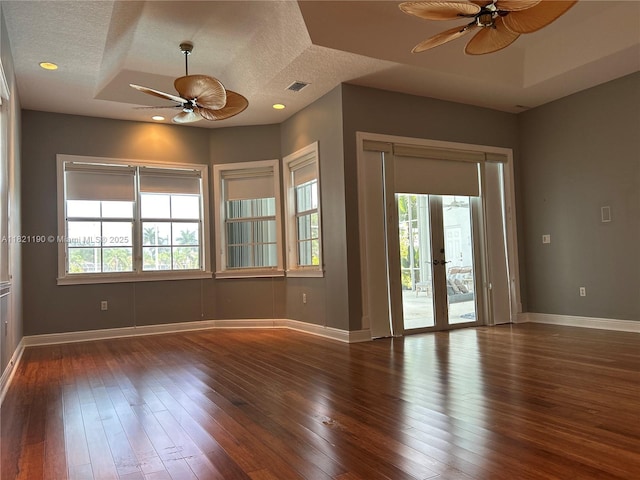 2640 Fairways Dr, Homestead, FL 33035 - empty room featuring a ceiling fan, a textured ceiling, plenty of natural light, wood-type flooring, and french doors