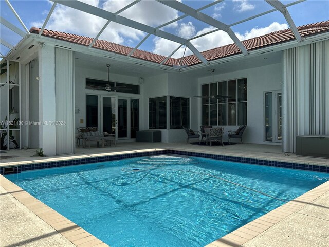 2640 Fairways Dr, Homestead, FL 33035 - outdoor pool with a patio, a ceiling fan, and glass enclosure