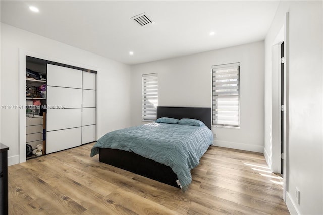 3910 NE 27th Ter, Lighthouse Point, FL 33064 - bedroom with multiple windows, recessed lighting, and wood finished floors