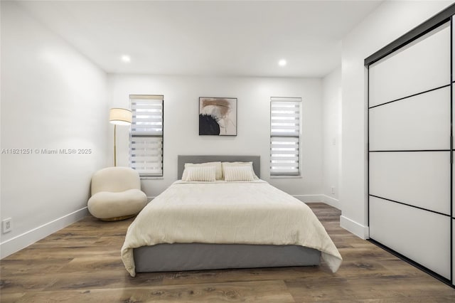 3910 NE 27th Ter, Lighthouse Point, FL 33064 - bedroom with multiple windows, recessed lighting, and wood finished floors