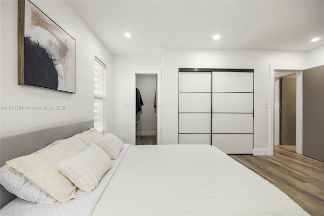 3910 NE 27th Ter, Lighthouse Point, FL 33064 - bedroom featuring wood finished floors and recessed lighting