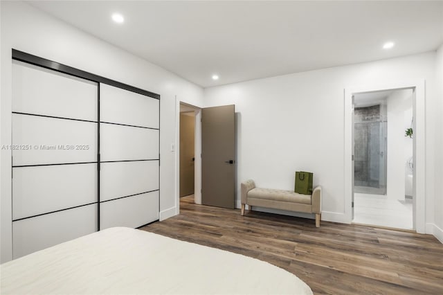3910 NE 27th Ter, Lighthouse Point, FL 33064 - bedroom with wood finished floors, recessed lighting, and ensuite bath