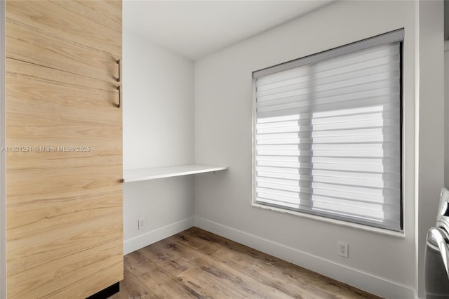 3910 NE 27th Ter, Lighthouse Point, FL 33064 - spare room featuring wood finished floors and baseboards