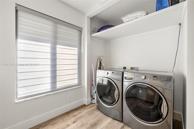 3910 NE 27th Ter, Lighthouse Point, FL 33064 - laundry room featuring separate washer and dryer and light wood-type flooring