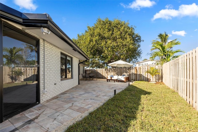 3910 NE 27th Ter, Lighthouse Point, FL 33064 - fenced backyard featuring an outdoor living space and a patio