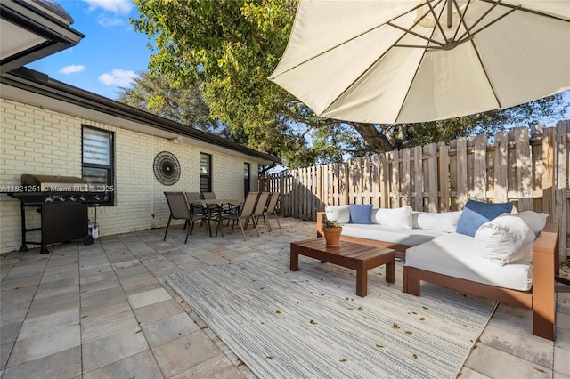 3910 NE 27th Ter, Lighthouse Point, FL 33064 - deck with outdoor dining area, outdoor lounge area, a fenced backyard, and area for grilling