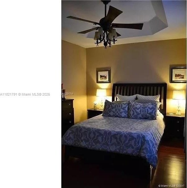 2402 NE 41st Pl, Homestead, FL 33033 - bedroom featuring wood finished floors and ceiling fan