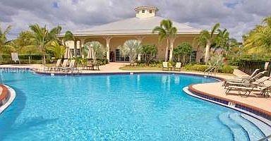 2402 NE 41st Pl, Homestead, FL 33033 - community pool featuring a patio