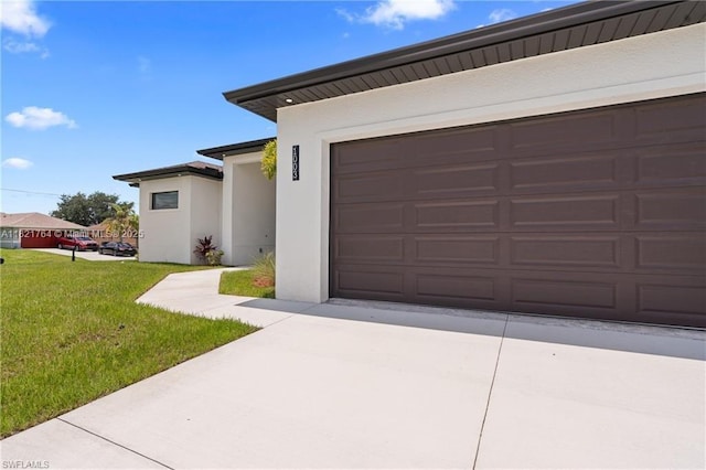 1003 Casino Ave, Lehigh Acres, FL 33971 - garage featuring concrete driveway