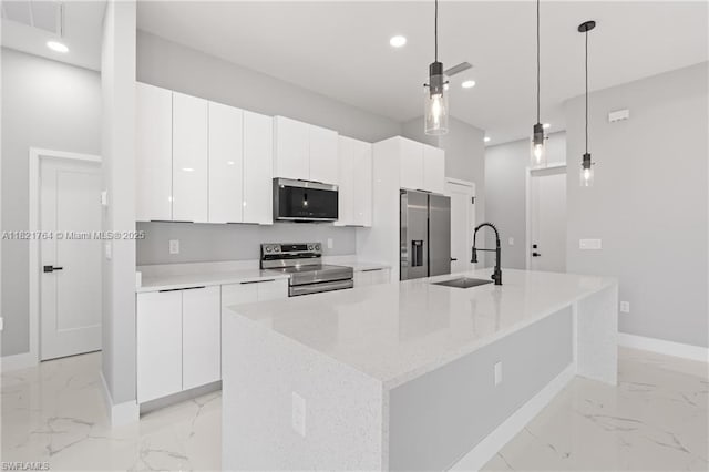 1003 Casino Ave, Lehigh Acres, FL 33971 - kitchen with stainless steel appliances, recessed lighting, light marble finish flooring, white cabinetry, and modern cabinets