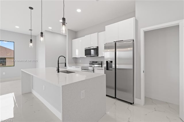 1003 Casino Ave, Lehigh Acres, FL 33971 - kitchen with appliances with stainless steel finishes, light marble finish floors, white cabinetry, modern cabinets, and recessed lighting